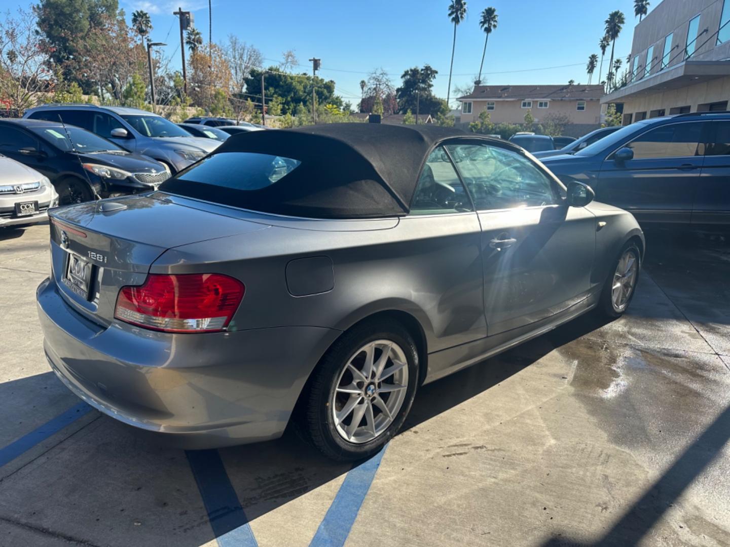 2011 Gray /Black BMW 1-Series 128i Convertible (WBAUN1C52BV) with an 3.0L L6 DOHC 24V engine, Automatic transmission, located at 30 S. Berkeley Avenue, Pasadena, CA, 91107, (626) 248-7567, 34.145447, -118.109398 - Low Miles!!! Elevate your driving experience with our 2011 BMW 1-Series 128i Convertible, now featured at our Buy Here Pay Here (BHPH) dealership in Pasadena, CA. Ideal for enthusiasts in Altadena CA, Glendale CA, Los Angeles CA, and throughout LA County, this stunning pre-owned convertible combine - Photo#4